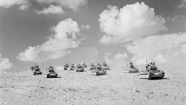 Old photo of army tanks moving across battlefield
