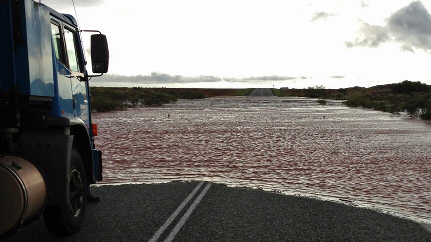 Rain from Cyclone Peta closes highway.