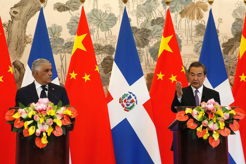 Chinese Foreign Minister Wang Yi, right, holds a press briefing with Dominican Foreign Minister Miguel Vargas.