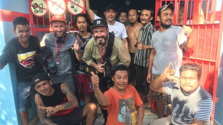 Foreign Correspondent producer/cameraman Matt Davis and cameraman Phil Hemingway with inmates inside Bali's Kerobokan prison