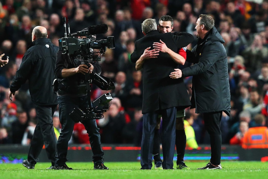 Brilliant signing ... Alex Ferguson embraces his lynchpin signing Robin van Persie after the match.