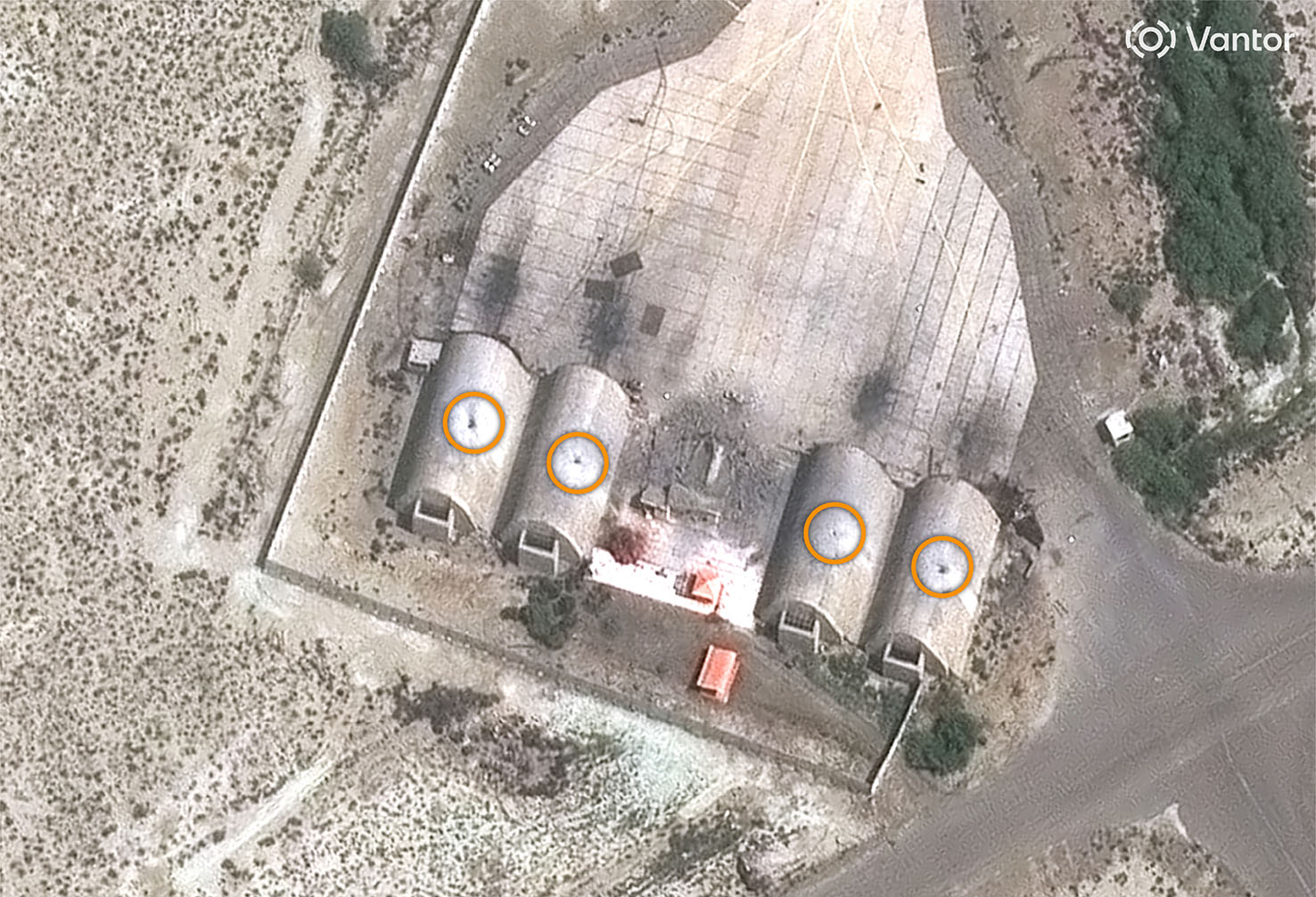 Iran images show destroyed buildings, impact craters, submerged ships