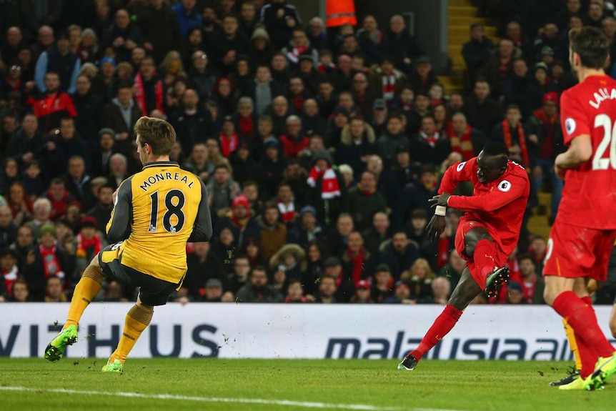 Liverpool's Sadio Mane (C), scores his side's second goal against Arsenal on March 4, 2017.