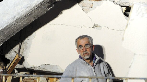 Man searches quake rubble for relatives