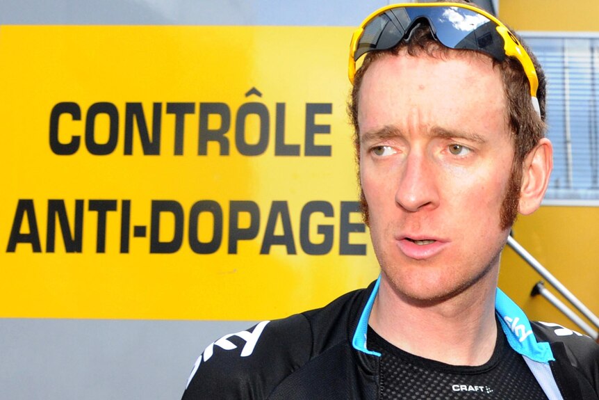 Bradley Wiggins leaves the anti-doping control bus of the 2012 Tour de France.