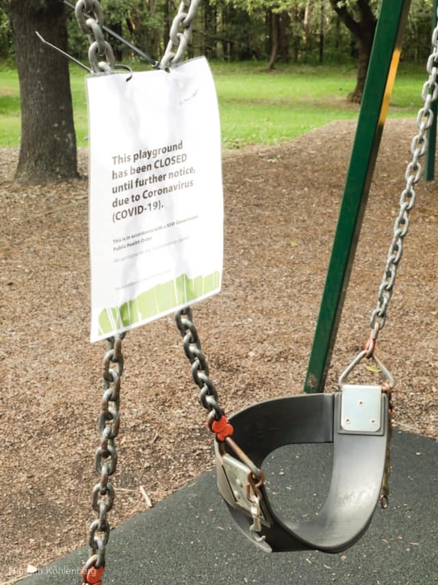 Swings closed at a playground.