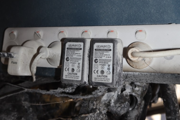 Electrical power board with burnt material nearby