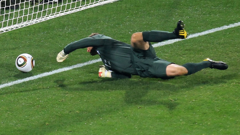 Oh no: England 'keeper Robert Green let the USA back into the match with this error in the first half.