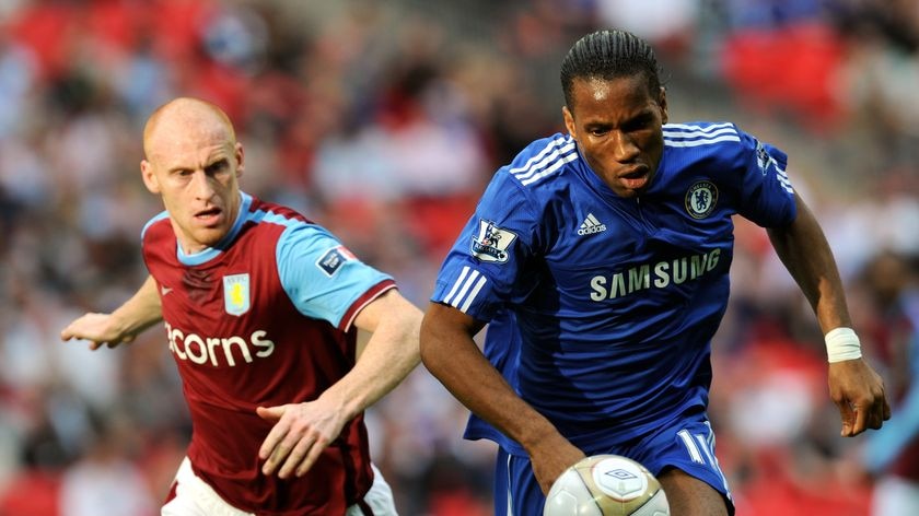 Drogba leaves Villa's James Collins in his wake.