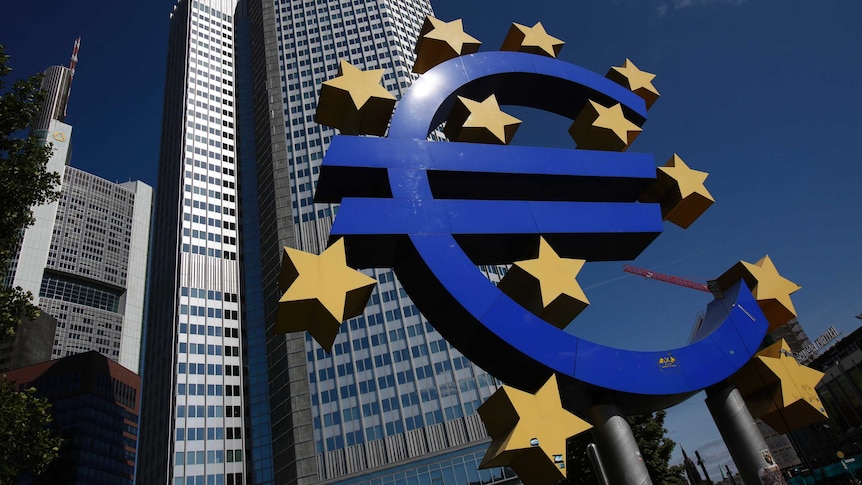 A Euro currency sign is seen in front of the European Central Bank headquarters building.