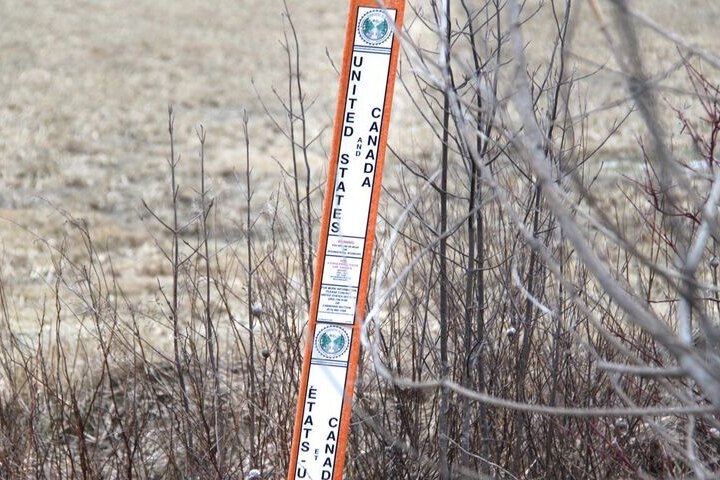 A marker shows where the US border ends and Canada's border starts.