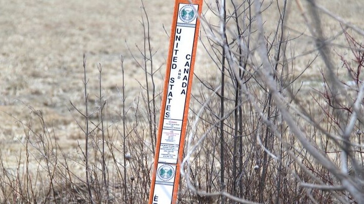 A marker shows where the US border ends and Canada's border starts.