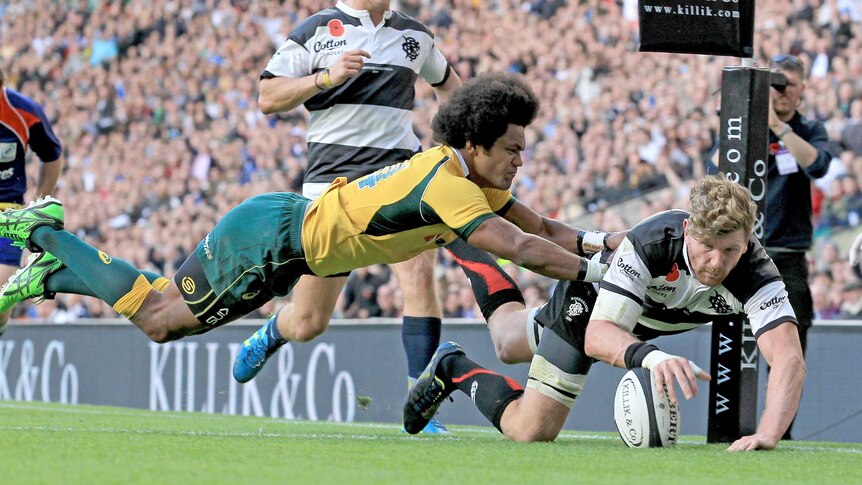 Key signing ... Adam Thomson scores a try for the Barbarians against the Wallabies last year