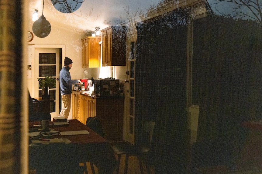 A man making food in his kitchen