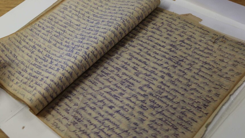 An open notebook showing a hand-written diary.
