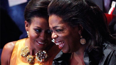 Oprah Winfrey sits with US first lady Michelle Obama at the opening Ceremony of the 121st IOC Session at the Copenhagen Opera...