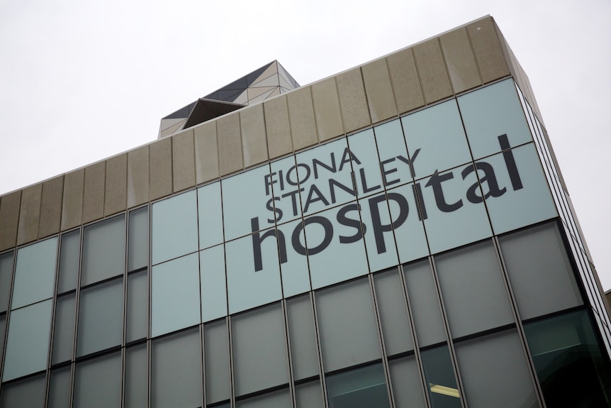 A sign on a building saying Fiona Stanley Hospital