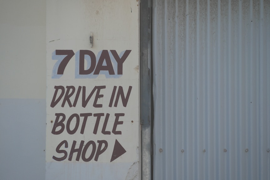 Sign reading 7 day drive in bottle shop 