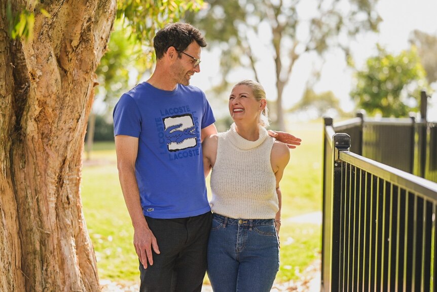 Brisbane woman Jacqueline Goodwin smiles at her partner Jamie in a park
