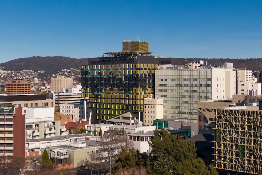 An aerial image shows the Royal Hobart Hospital and surrounds.