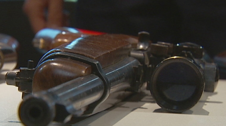 Police display rifle surrendered to police during gun amnesty in South Australia, 17 September 2012