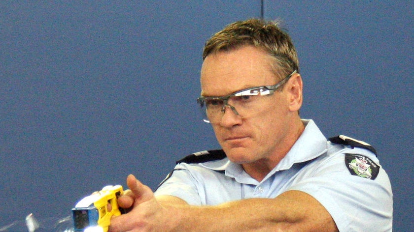 A Victorian policeman using taser