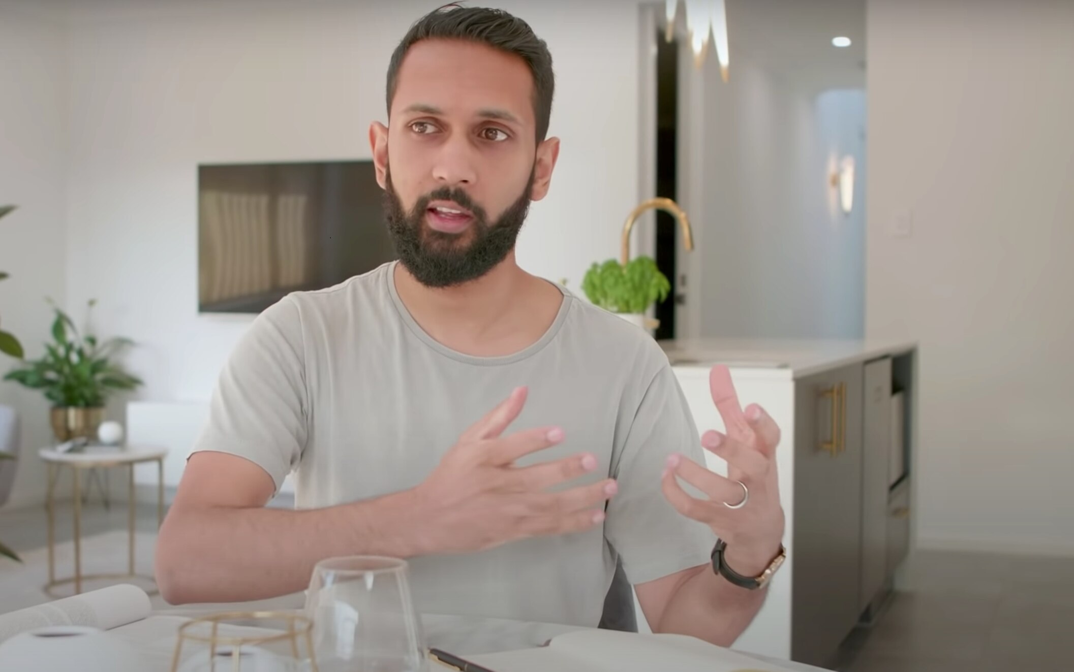 Kiran Skariah talks in his home in south-western Sydney.