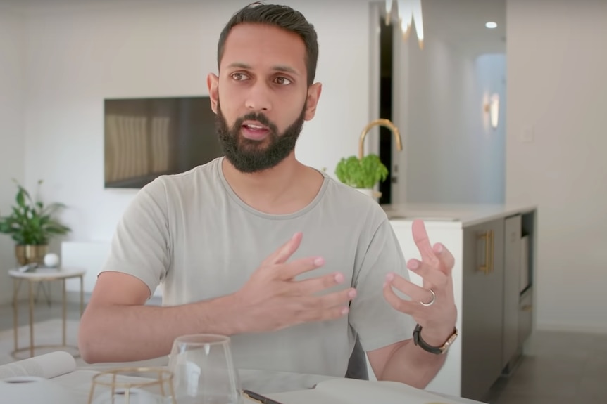 Kiran Skariah talks in his home in south-western Sydney.