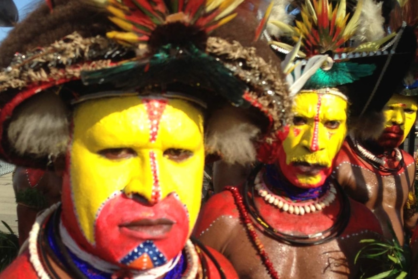 Huli Wigmen wait to greet Julia Gillard in PNG