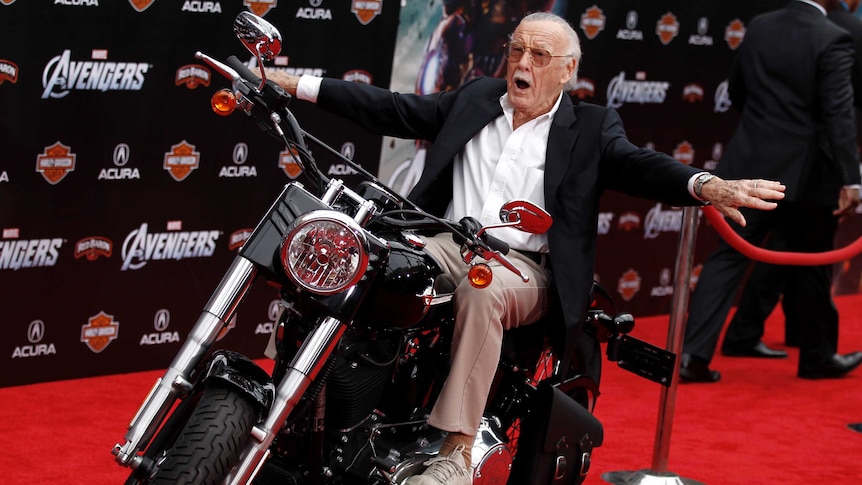 Stan Lee arrives at the 2012 premiere of The Avengers on a motorbike.