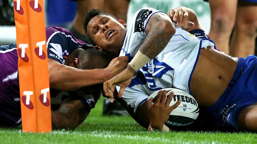Tough night: Ben Barba is thrown into touch by the Storm.