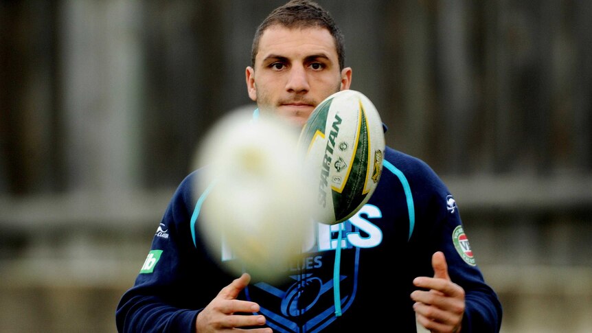 Blues captain Robbie Farah catches a ball at NSW training.