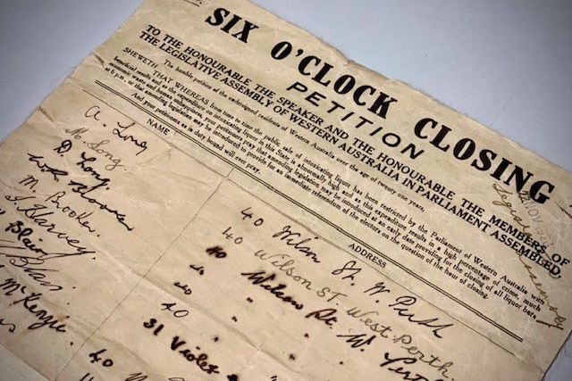 A close-up shot of WA's Six O'Clock Closing Petition from 1928, showing a headline and explanation and a list of signatures.