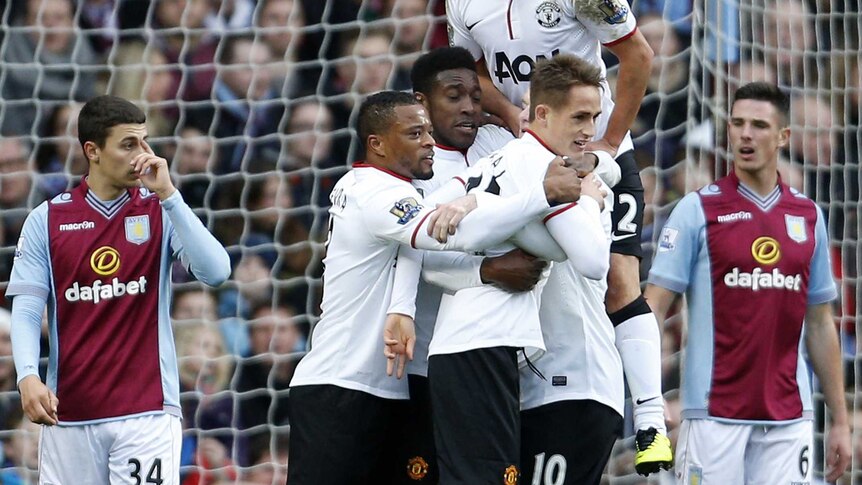 Manchester United players celebrate Danny Welbeck's opener against Aston Villa
