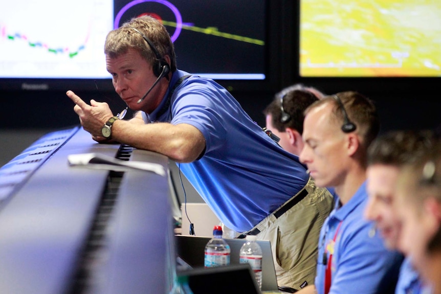 Peter Ilott (L) works in the Spaceflight Operations Facility for NASA's Mars Science Curiosity Rover