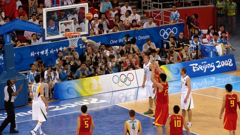 Yao Ming shoots at goal during China's 94-68 defeat by Lithuania