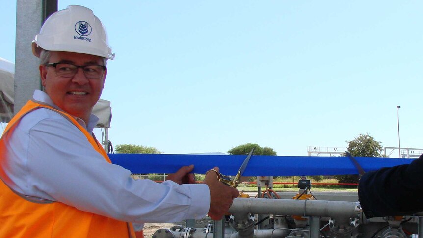 GrainCorp's Mark Palmquist and Wollongong mayor Gordon Bradbury cut the ribbon on chemical silos at Port Kembla