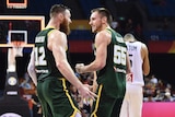 Australia's Aron Baynes and Mitch Creek celebrate after winning against France at the FIBA World Cup
