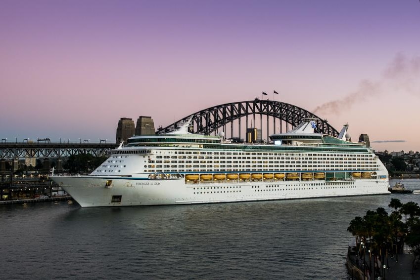 Voyager of the Seas berthed at Circular Quay in Sydney with the Harbour Bridge in the background