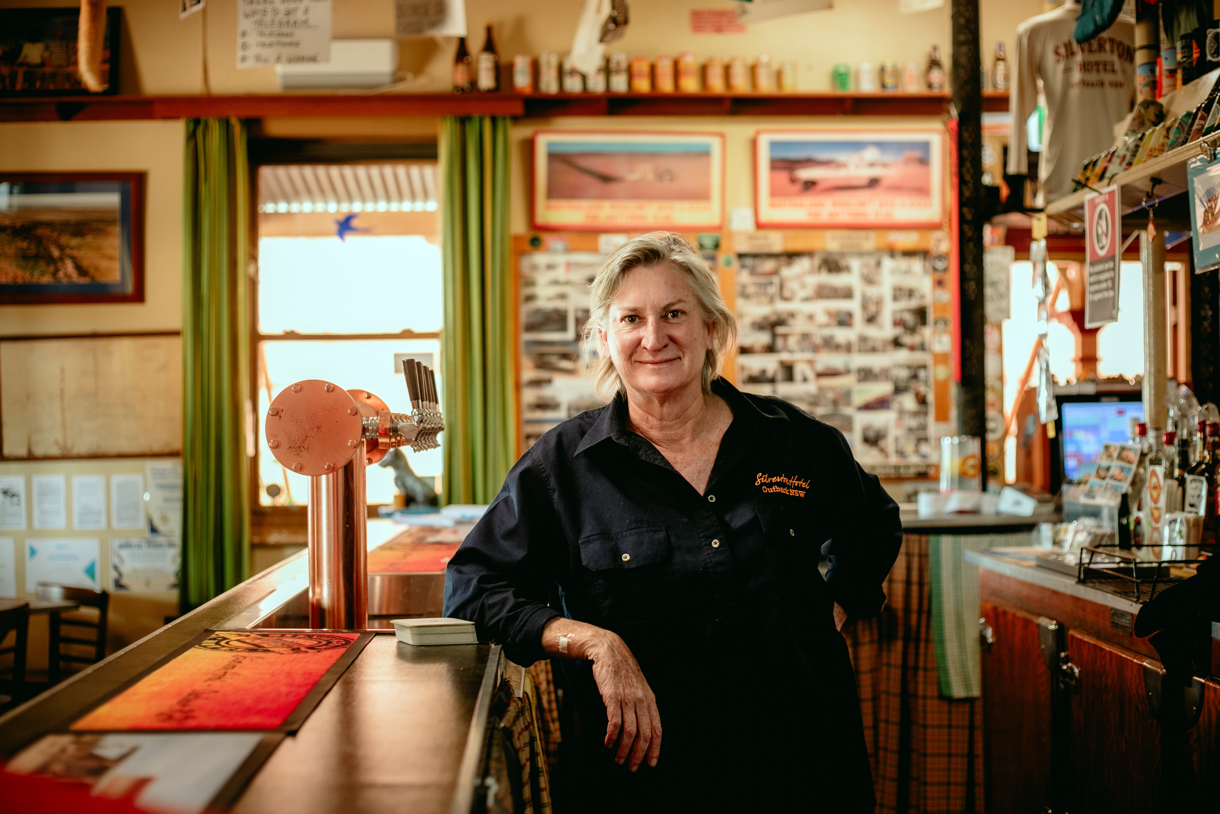 Publican Liz Murphy stands behind the bar at the Silverton Hotel.