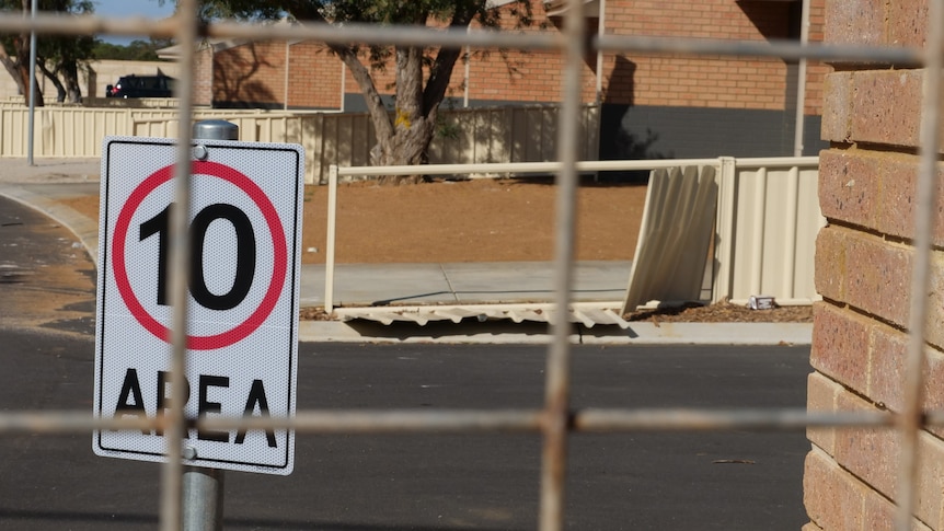 fence and speed sign at units