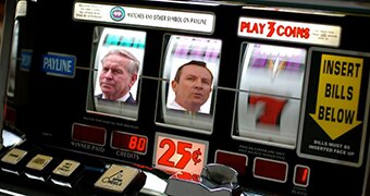 A slot machine with the faces of Colin Barnett and Mark McGowan superimposed on it.