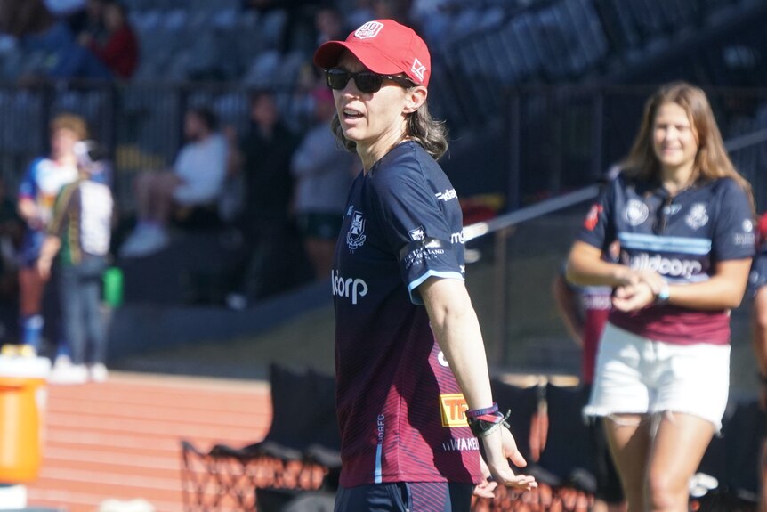 Flick Goodwin watches her Queensland Reds players from the sideline