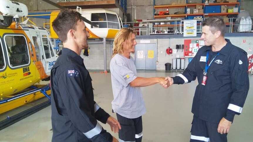 Tourist Levi Verwoest thanks the his rescuers a day after being airlifted from his overturned catamaran.