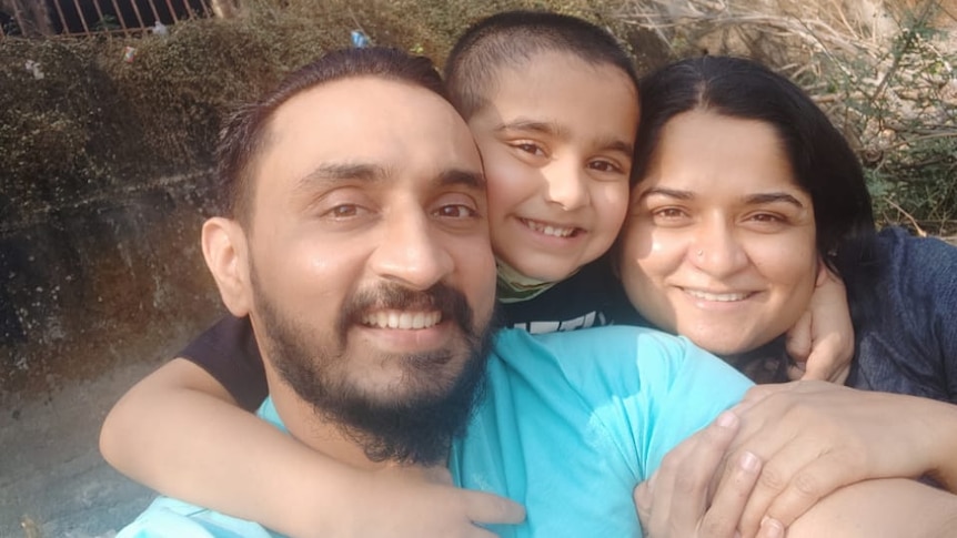Virendrasinha Bhosale is embraced by his son and wife in this selfie taken after he returned home.