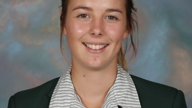 A photo of a teenage girl in school uniform.