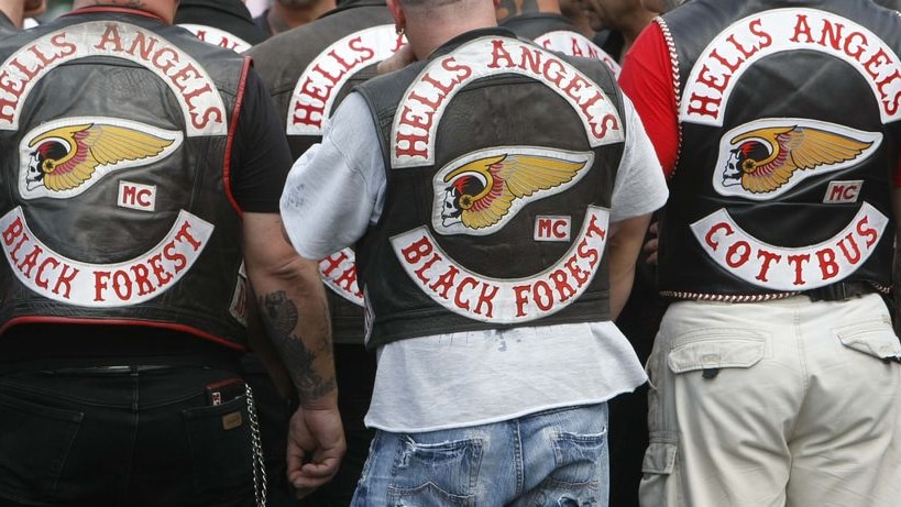 Members of the motorcycle gang 'Hell's Angels' stand outside court
