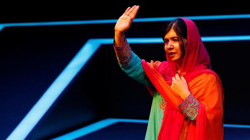 Malala Yousafzai waves