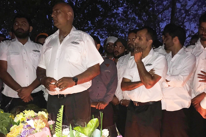 Taxi drivers attended the vigil in memory of the bus driver who was killed in front of passengers earlier on Friday.