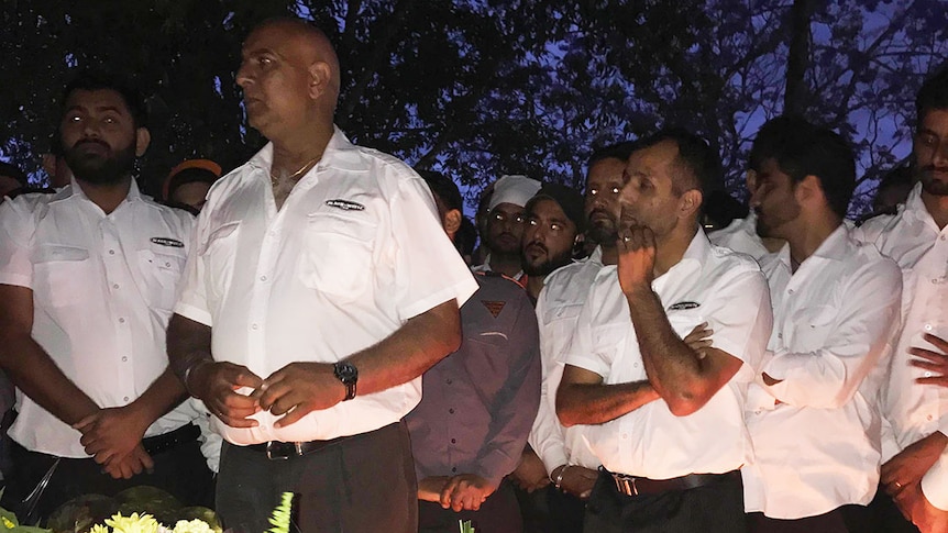 Taxi drivers at a vigil honouring Brisbane City Council bus driver Manmeet Alisher